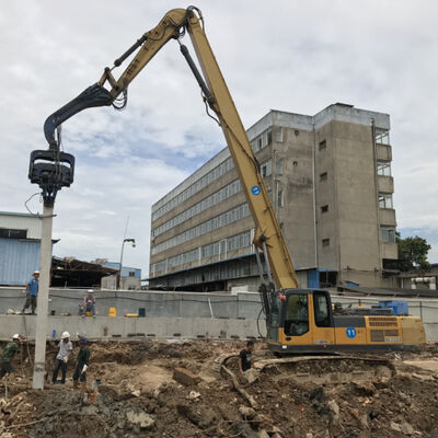 Through-Wall Pile Driver: High Excitation Force & Compact Excavator Vibro Hammer Design